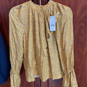 Size 4. Never worn. Tags still attached. Bought for $395